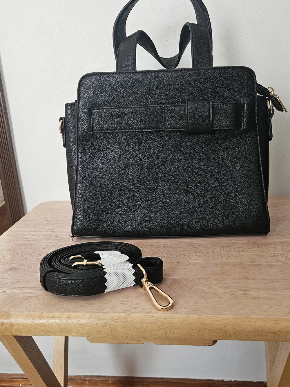 Black Structured Women's Handbag with Detachable Strap.